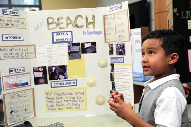 Kids show off their displays at science fair.