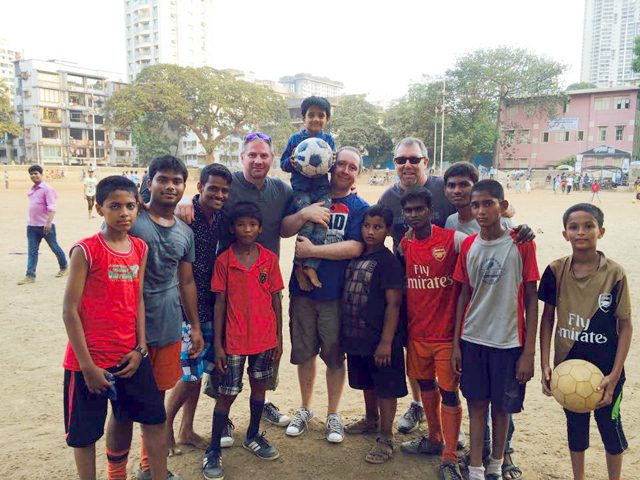 Major John Murray, David Giles and Gary Rose with the boys from The Salvation Army Jeevan Asha night shelter.