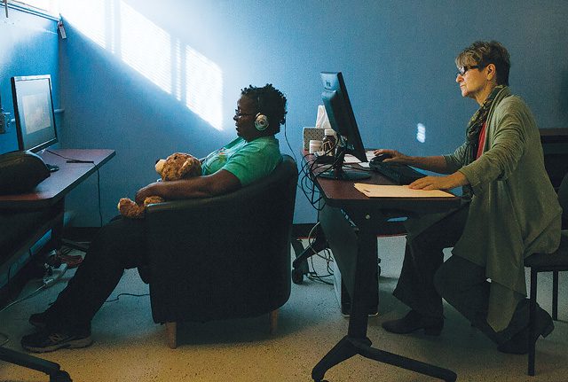 Neurofeedback practitioner Clare Chisholm conducts a session on U.S. Air Force veteran, Teri, at The Haven in Los Angeles. | Photo by John Docter