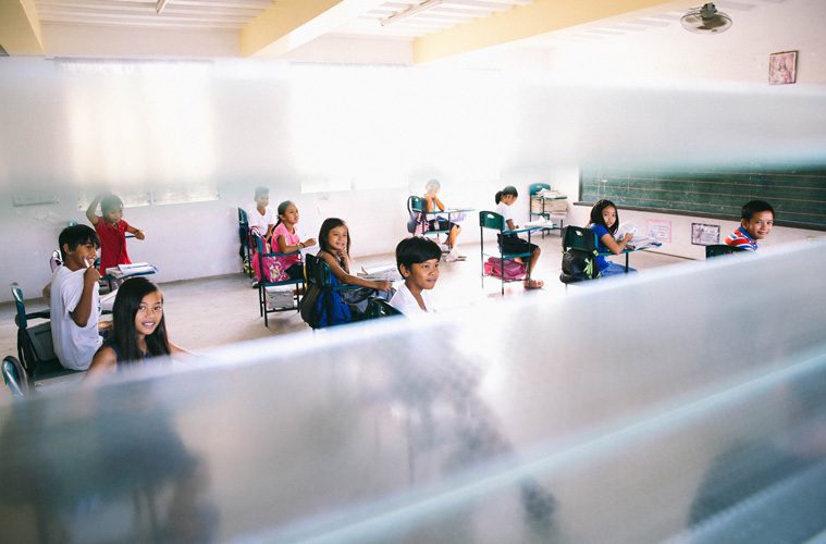 children sitting at desks in school