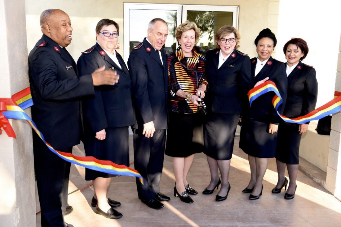 Diane McCarthy and Salvation Army Officers Cutting Ribbon