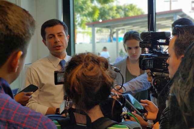 Mayor Pete Buttigieg speaking with reporters