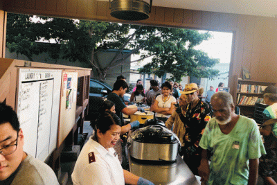 line of people being served food