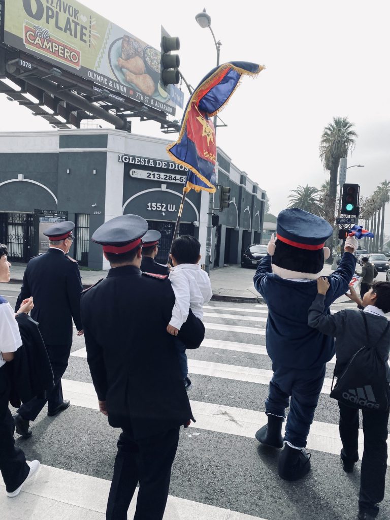 Back view of Salvationists walking outside