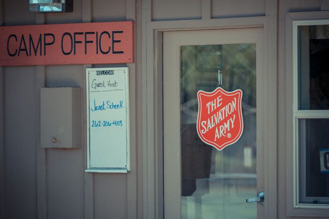 Building with Salvation Army logo hanging on glass door