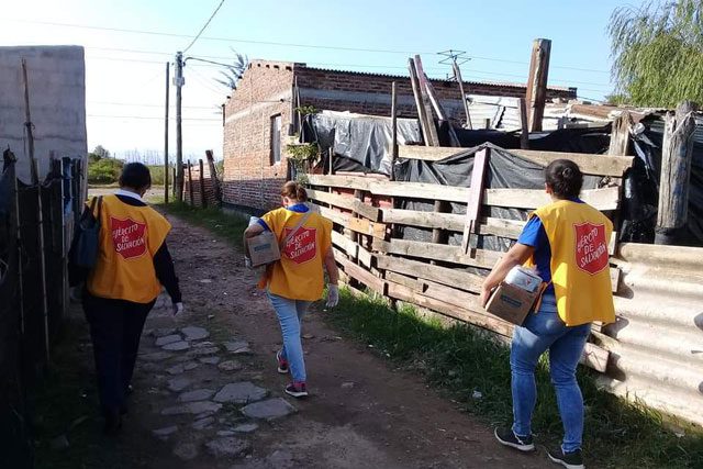 Salvation Army workers Walking in Village in Uruguay